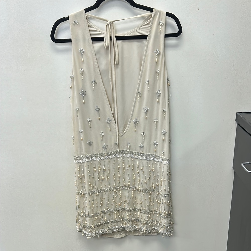 Elegant Cream Beaded Dress.  Gently worn at wedding Fits right in all the places